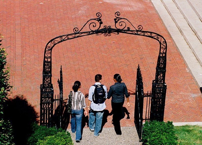 Image of students walking through gate